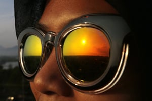 A reflection of the sun is seen in sunglasses worn during a solar eclipse in Banda Aceh, Indonesia.