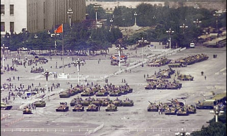 Tanks mass in Tiananmen Square in June 1989 as the Chinese authorities quell the demonstrations.
