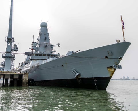 HMS Dragon alongside at the upper harbour ammunition facility