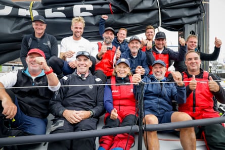 The crew of Alive sitting on the yacht after finishing