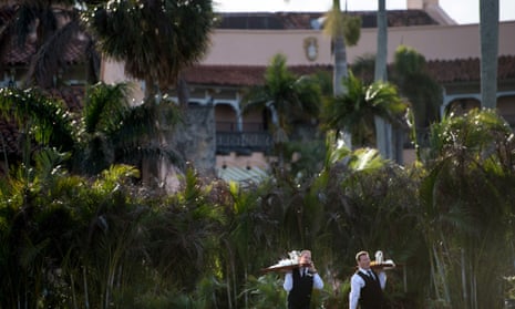 Staff carry trays of coffee at Mar-a-lago while the President is in residence