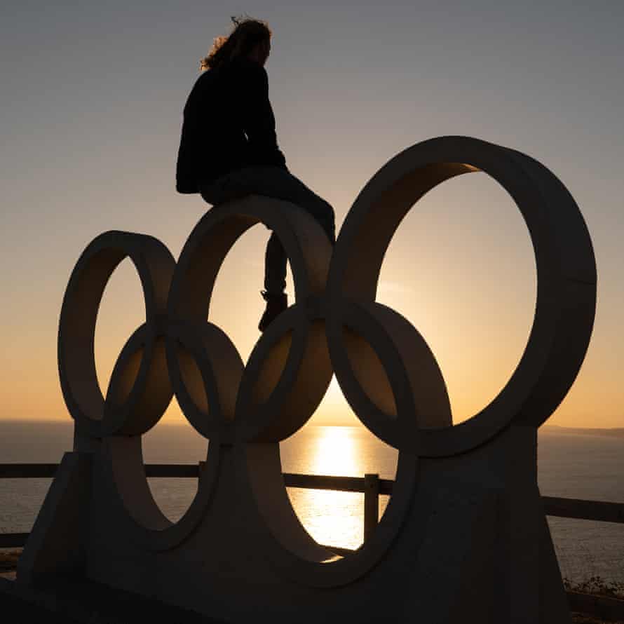 Tom Squires on the stone structure of the Olympic rings at New Ground in Portland, Dorset, during July 2020.