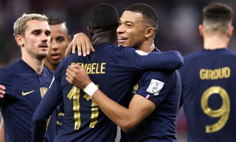 Kylian Mbappé is congratulated by his France teammates after the first of his two goals against Poland
