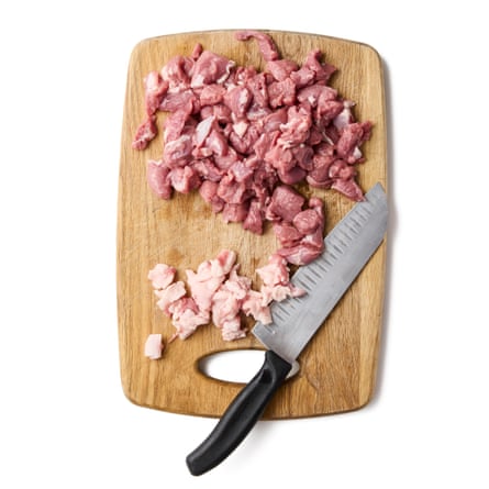 Lamb on a chopping board with the fat cut off