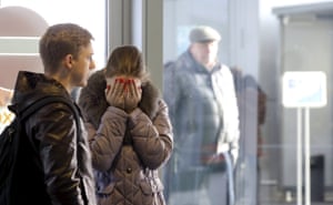 A woman reacts at Pulkovo airport.