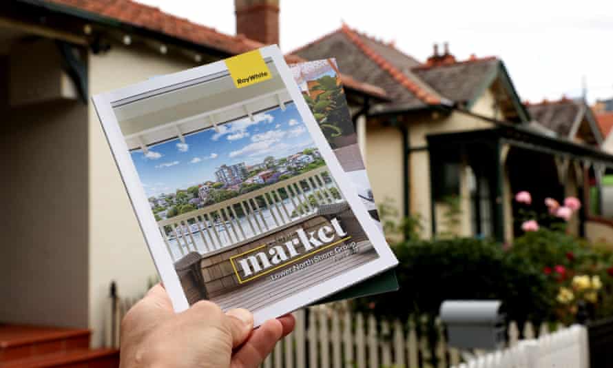 Real estate booklets displaying properties for sale