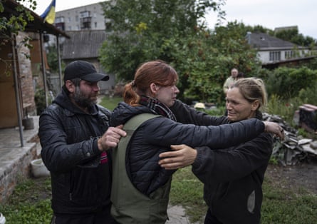 Maria hugs her parents, Marina and Alexander, during their first meeting since the beginning of the war, 14 September.