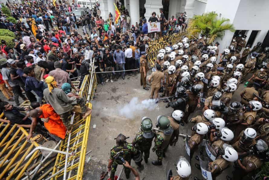 Security forces fire tear gas to disperse an anti-government protest rally in Colombo