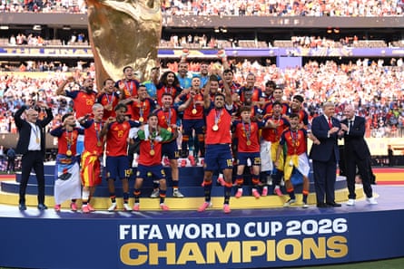 Donald Trump and Gianni Infantino pictured with Spain as the winners celebrate with the trophy.