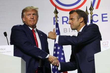 France’s President Emmanuel Macron (R) and US President Donald Trump shake hands.