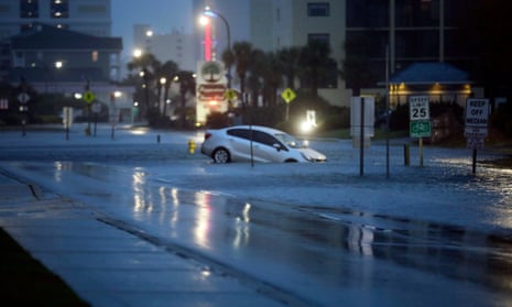 A car plunged into flood waters on Ocean Boulevard in North Myrtle Beach, South Carolina, on Wednesday after the passage of Hurricane Idalia.