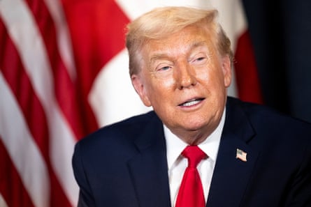 Donald Trump at Davos in front of a US flag
