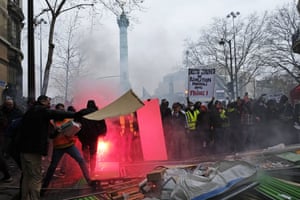 French riot police face yellow protesters in Place de la Bastille last weekend