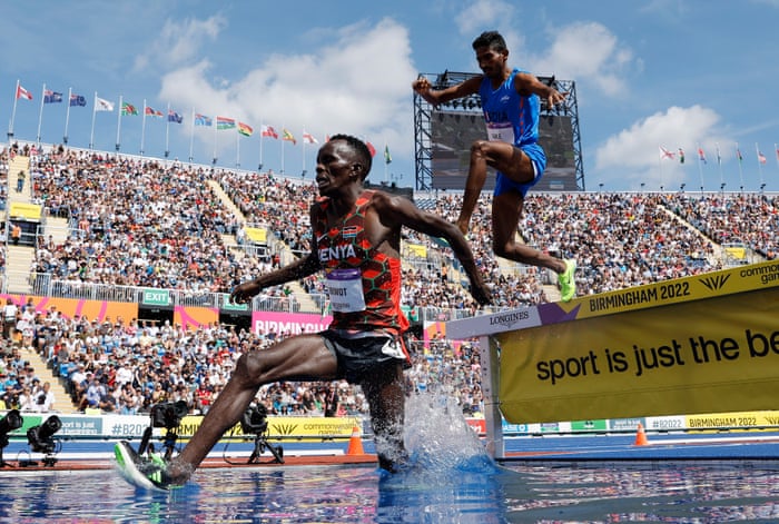 Abraham Kibiwot of Kenya leads India’s Avinash Mukund Sable during the men’s 3000m steeplechase final.
