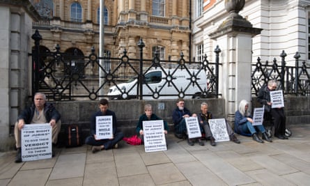 People hold a vigil outside Reading crown court after 11 people were arrested outside Southwark crown court for holding signs saying: ‘Juries deserve to hear the whole truth.’