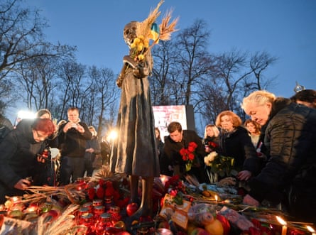 People lighting candles last year at a monument in Kyiv for victims of the Holodomor famine of 1932-33.