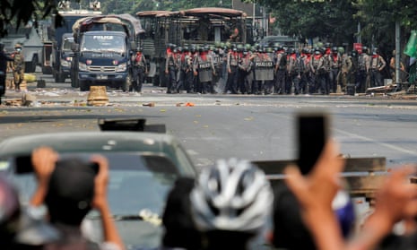 A standoff between Myanmar riot police and anti-coup protesters in Mandalay in March