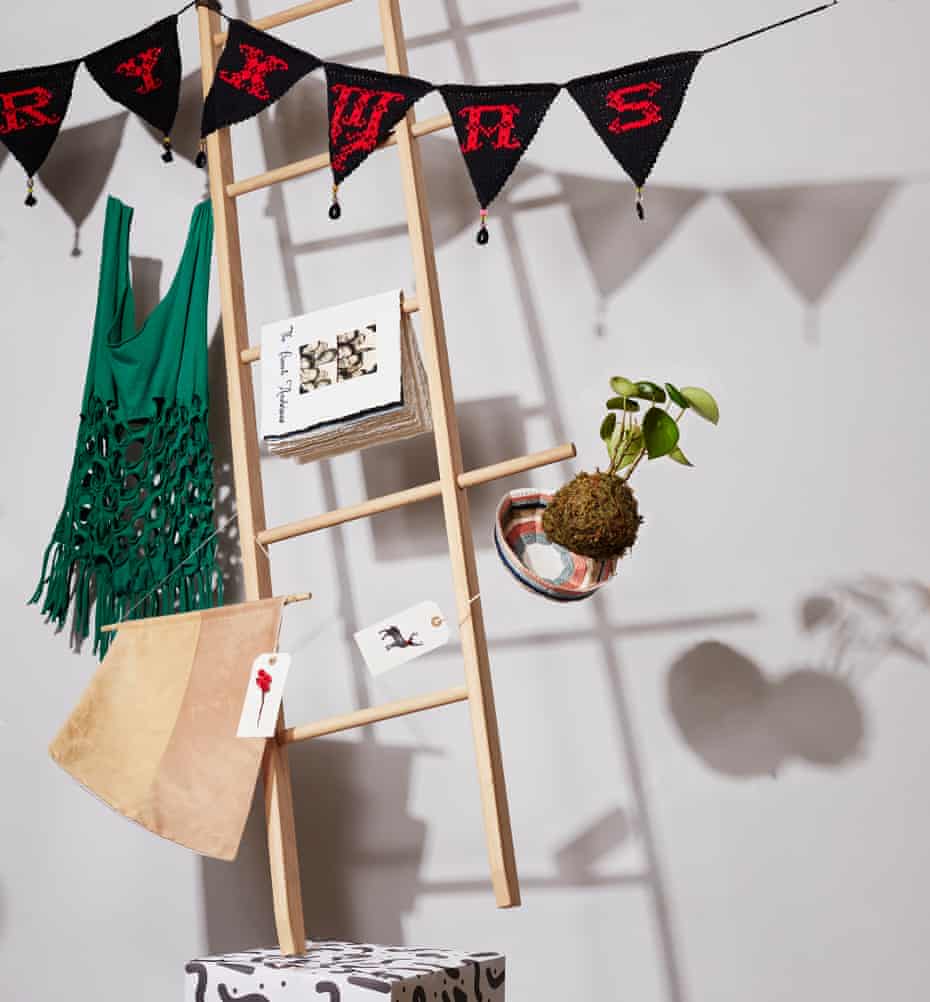 A ladder with homemade Christmas gifts on