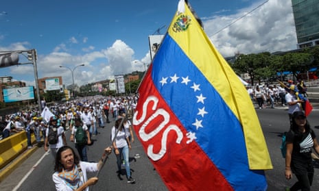 Demonstrators challenge the government in Caracas, Venezuela, on Monday.
