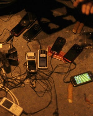 Egyptian protesters charge their phones in Tahrir Square.