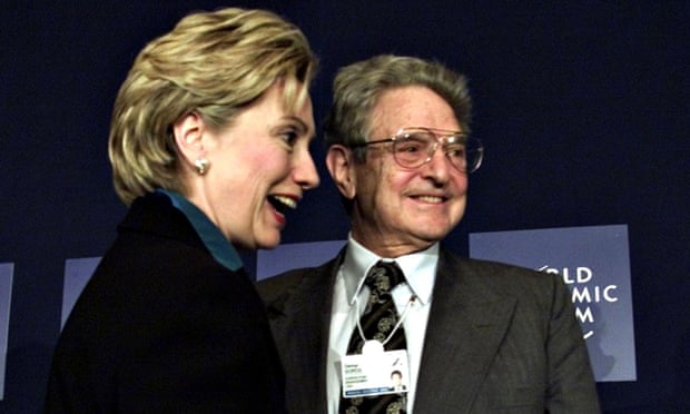 Head shot of George Soros with then New York senator Hillary Clinton at the World Economic Forum in 2002