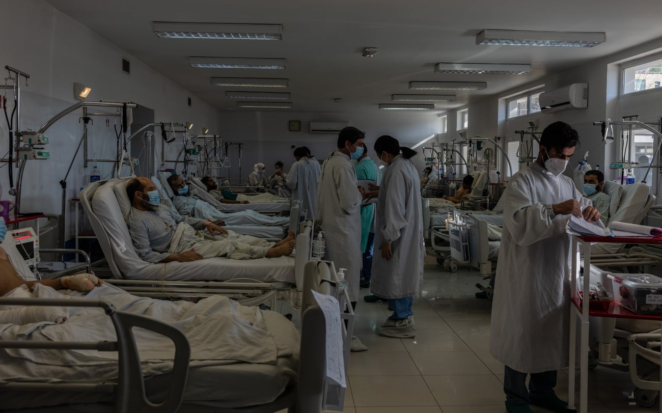 Doctors and nurses during their morning rounds at hospital in Kabul, in February 2022. Though fewer people have been arriving at the hospital with war-related injuries, more have been turning up with gunshot wounds.