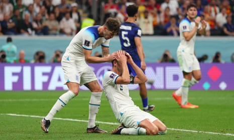 Harry Kane is consoled by John Stones.