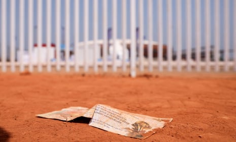A match ticket lies on the ground at the scene of the tragedy outside the Olembe Stadium.