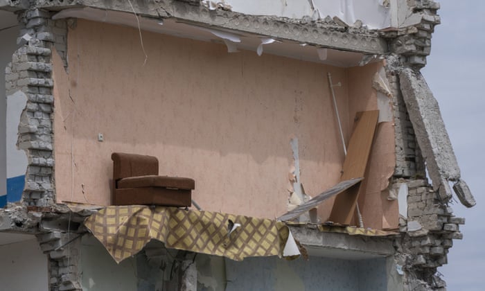 A sofa chair is seen in what is left standing in the aftermath of the Russian rocket that hit an apartment residential block, in Chasiv Yar, Donetsk region, eastern Ukraine. (AP Photo/Nariman El-Mofty).
