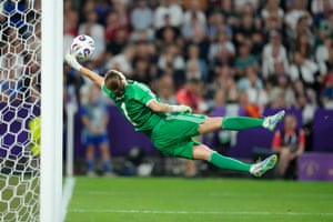 Germany’s Ann-Katrin Berger makes a singular prevention successful other clip against France during their quarter-final astatine St Jakob-Park