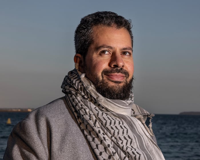 Palestinian careers adviser who was allegedly told to stop wearing keffiyeh at Sydney school sues for racial discrimination