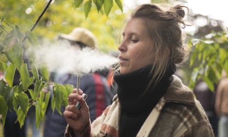 A woman smokes a marijuana cigarette in Toronto. A mix of retail chain distribution and logistical kinks have created fertile ground for the shortages.