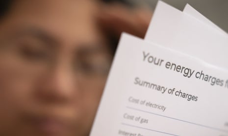 A model poses holding an energy bill.