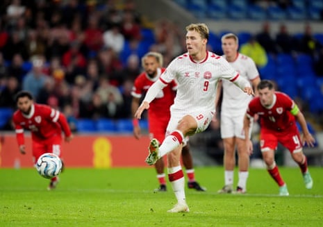 Denmark's Rasmus Hojlund scores his side's first goal from the penalty spot.