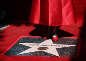 Carrie Underwood stands on her star during a ceremony on the Hollywood Walk of Fame in Hollywood, US