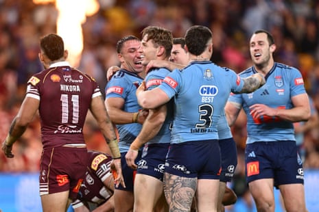 The Blues get around Cameron Murray after he scores their third try.