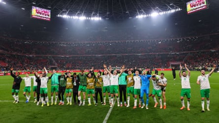 Ireland players celebrate in front of their disbelieving fans in Hungary.