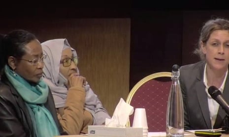 Wafa (left) and Hayat Elsanosi (centre) pay tribute Fathia Ali Ahmed Alsanousi at the Grenfell Tower Inquiry