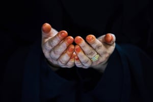 Two hands decorated with henna