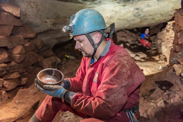Derbyshire Caving Club's Ed Coghlan with a bowl found in the mine.