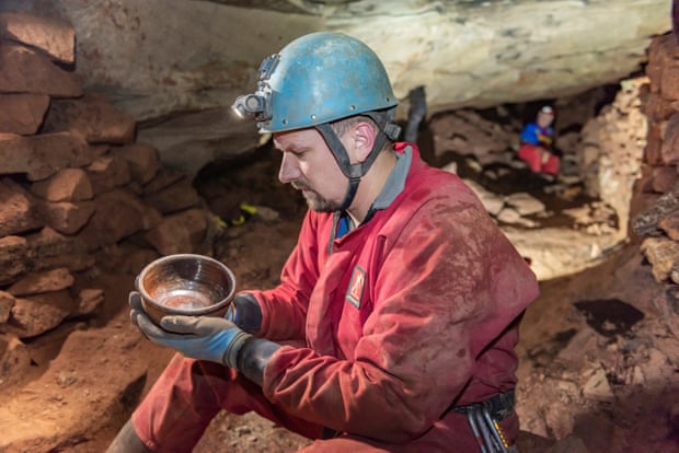 Derbyshire Caving Club’s Ed Coghlan with a bowl found in the mine.