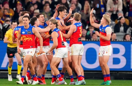 Brisbane celebrate as Henry Smith boots a goal against Collingwood