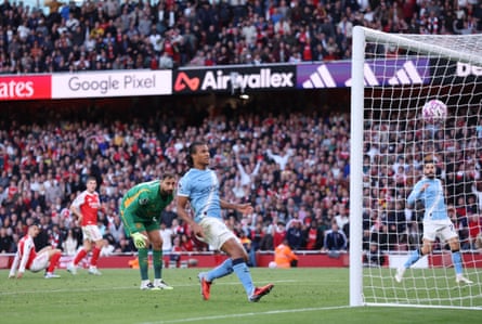Manchester City players watch as Gabriel Martinelli’s 93rd-minute equaliser drops into their net at the Emirates.