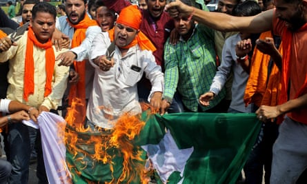 Demonstrators burn Pakistan’s national flag during a protest against the Uri army base attack in Kashmir last month.
