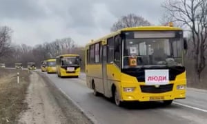 Buses drive to collect evacuees from Mariupol, according to this video still provided by a Ukrainian official in the President’s Office to Reuters.