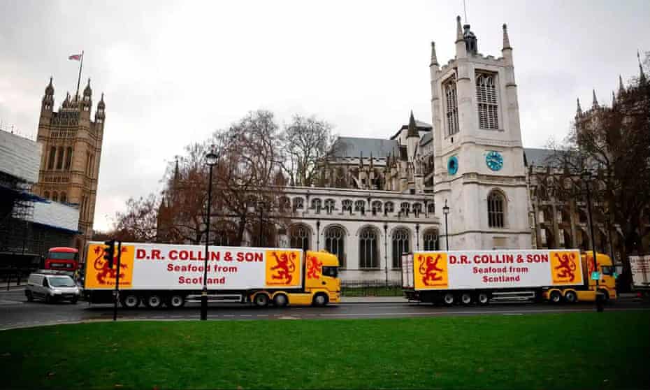 Two large lorries belonging to a Scottish seafood company parked in Parliament Square
