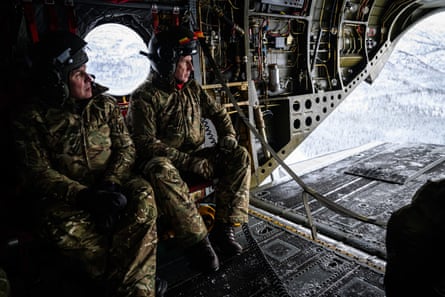 The former defence secretary John Healey (right) in a Chinook CH-47 helicopter with his Norwegian counterpart, Tore O Sandvik, in Norway in February.