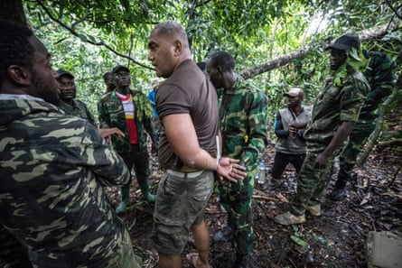 Gabon national park rangers make a mock arrest during a training exercise.