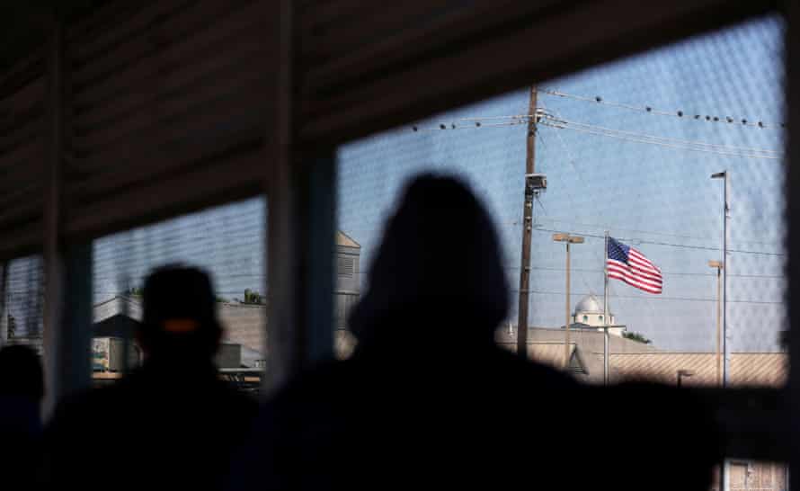 A US flag is pictured at Matamoros-Brownsville international border bridge, as seen from Matamoros, Mexico, on 19 February.