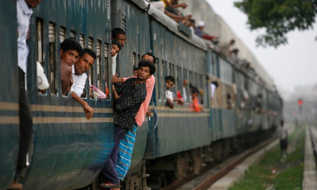 Passengers clinging to a train at Kamalapur rail station in Dhaka